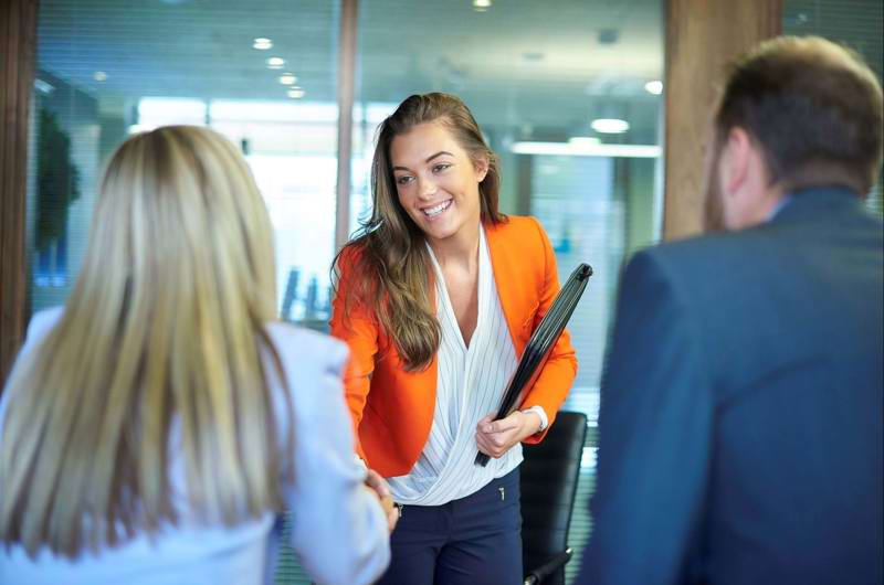 Woman shaking hands with an employer